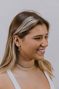Sadie medium link gold chain on model.
