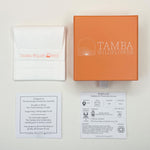 Load image into Gallery viewer, Parvati delicate stamped gold pendant necklace packaging.
