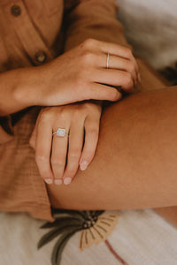 Delicate silver Suzy statement ring with square detail on model.